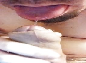 Licking the pre from my uncut cock