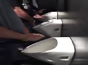 4 friendly guys meet at the urinals