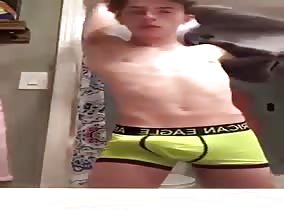 Hung twink dangles his dong
