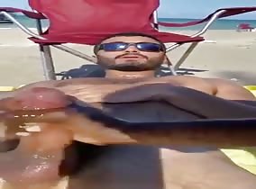 Hot boy gets jerked off at the beach