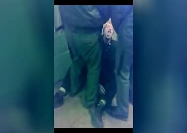 Guards piss on new arrival