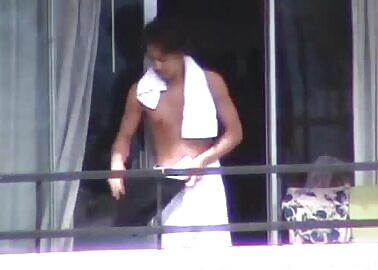 Stripping on the balcony 1