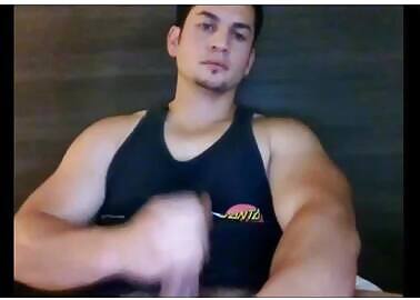 Handsome guy with big arms about to explode