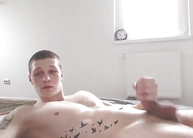 Nice tattooed boy sending a big cumshoot