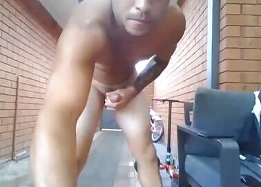 WELL-HUNG LATINO SURFER WITH A BAD FACE TAKING A LONG SHOOT