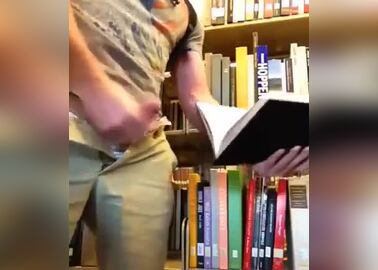 Guy cumming in pages of a library book in public