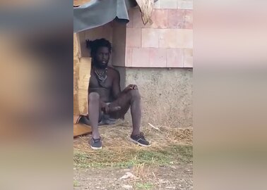 Homeless dude strokes his big black cock