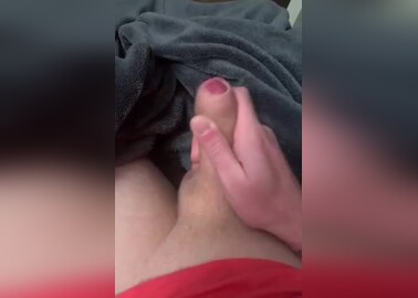 Playing with uncut cock