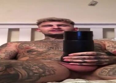 Sexy Tatted guy fucks fleshlight