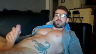 Beefy bearded guy with glasses