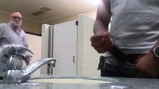 guy wanking in public bathroom
