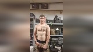 Soldier jerking off his cock in the army shed cumming