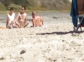 Spying on 2 guys jerking at beach
